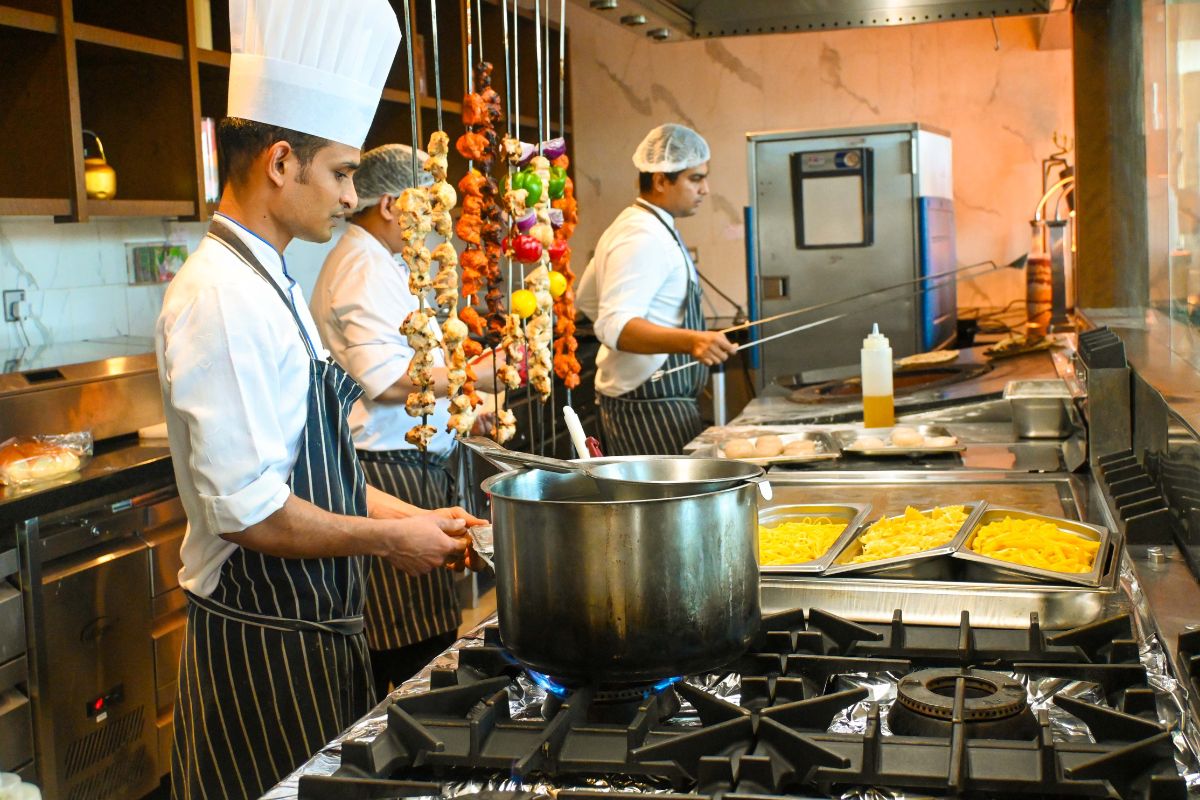 Chefs preparing the dishes at The Spicery Superhero brunch Wyndham Dubai Deira