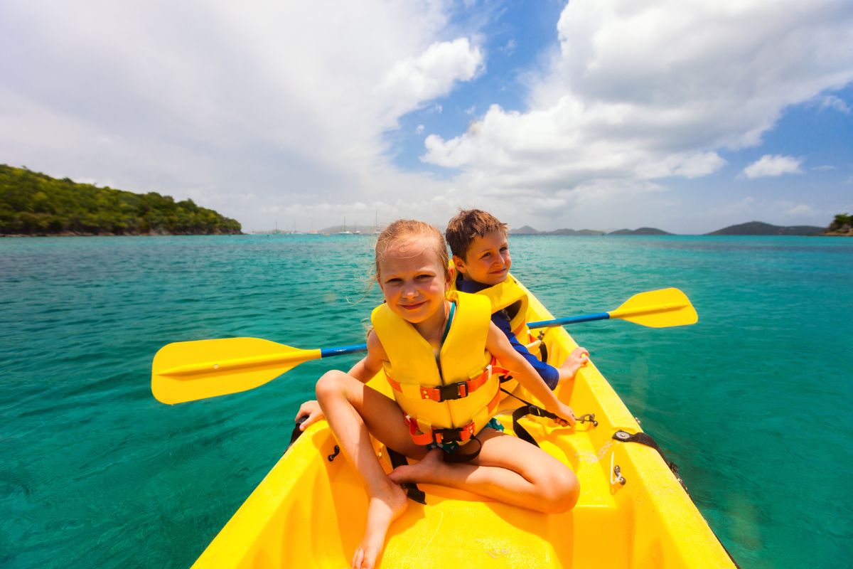 Kids Riding A Kayak This Summer