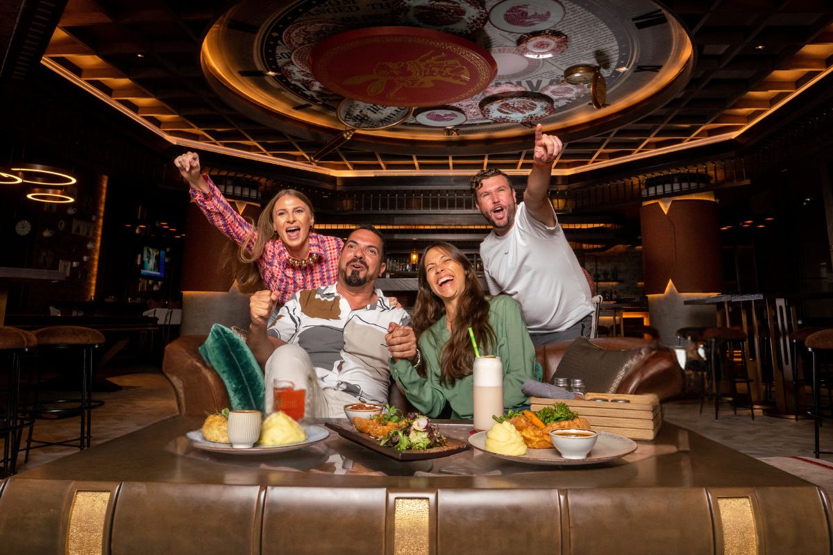 4 people cheering and watching Euro 2024 in Dubai at Roaring Rabbit, Taj Exotica Resort & Spa, The Palm, Dubai