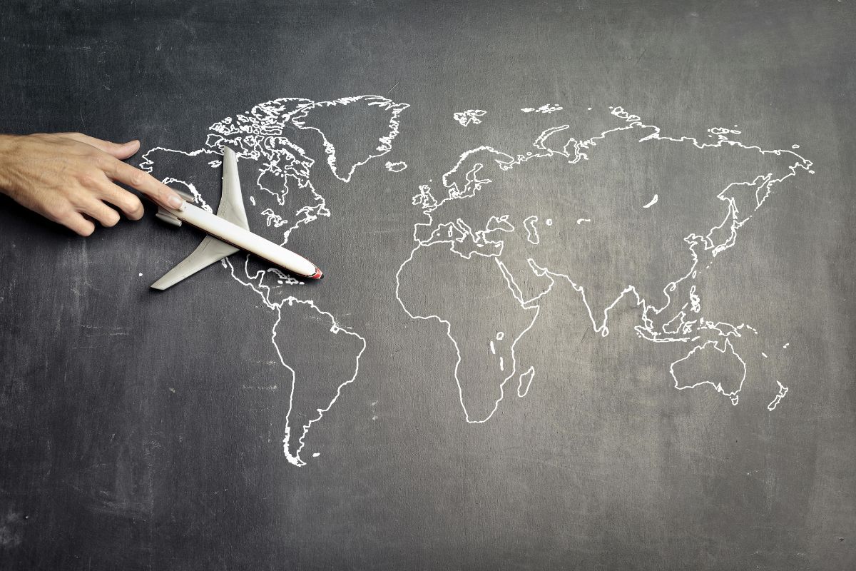 Featuring A Chalkboard With A World Map Drawing And A Toy Plane For Top Tips For New Teachers In The Uae