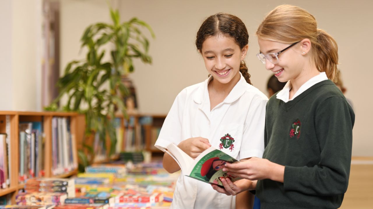 Jumeirah college students reading a book