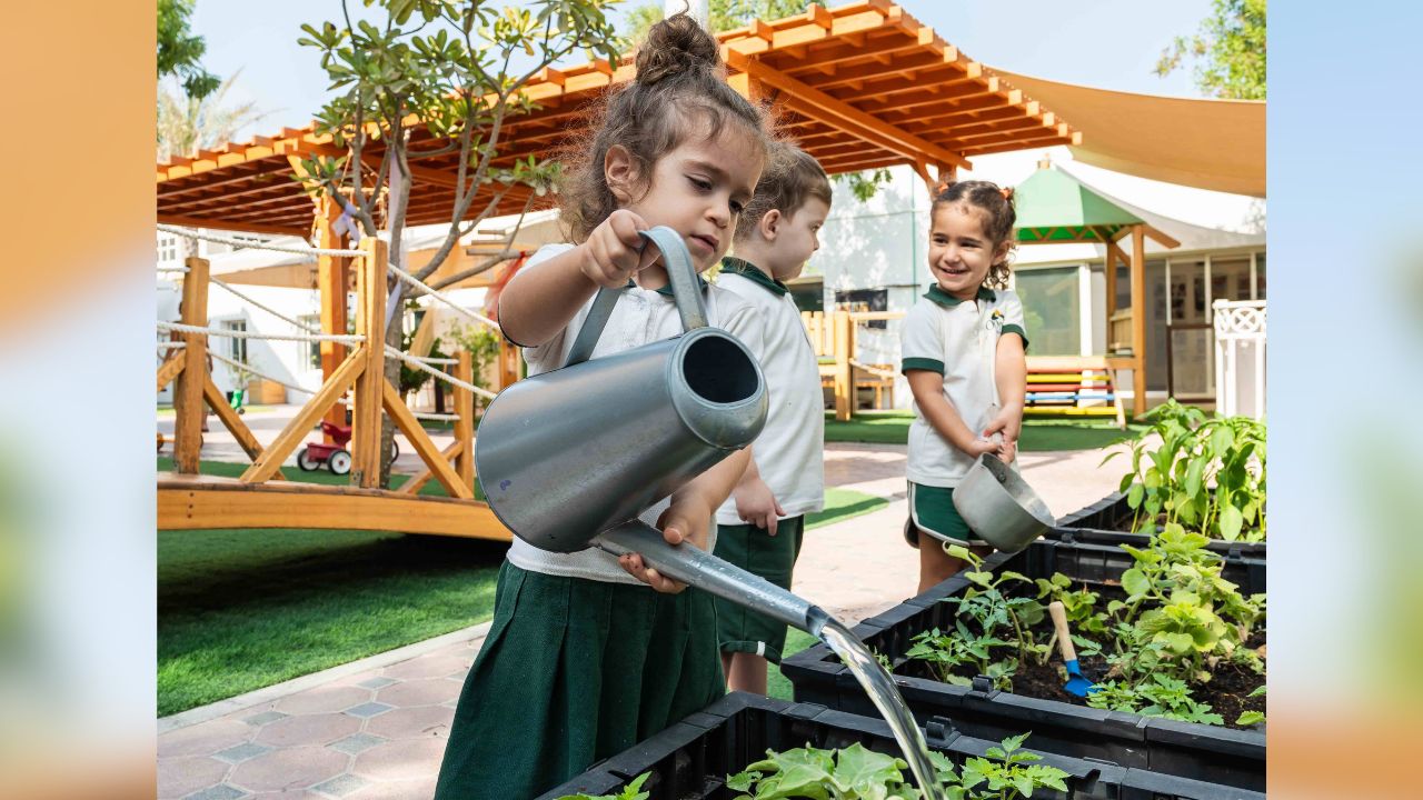 Odyssey Nursery students watering the plants