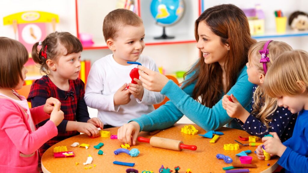 Children engaging in a classroom activity with a teacher.