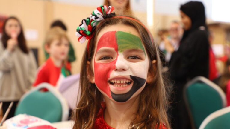 Student with painted face of uae flag