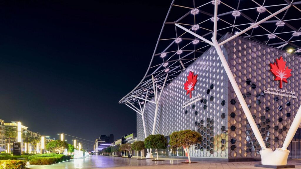 Yalla Dubai Life, modern architecture at Canadian University Dubai with iconic maple leaf design.