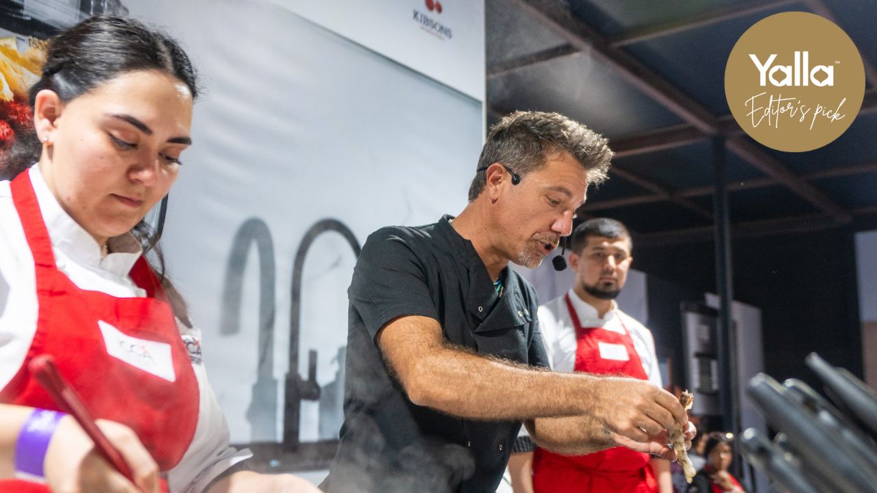 Vibrant chefs preparing dishes at Taste of Dubai 2026 event.