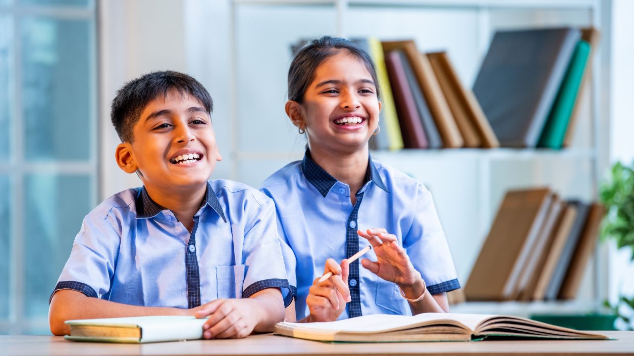 Happy schoolchildren studying together in Dubai.