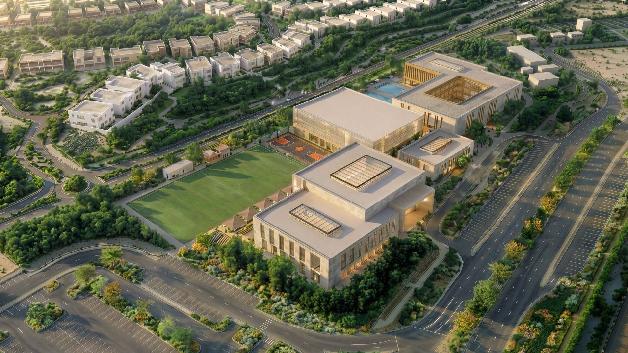 Modern educational campus in Dubai Production City with green fields and contemporary buildings Modern Dubai school campus with green fields and innovative architecture, part of the new British cu.