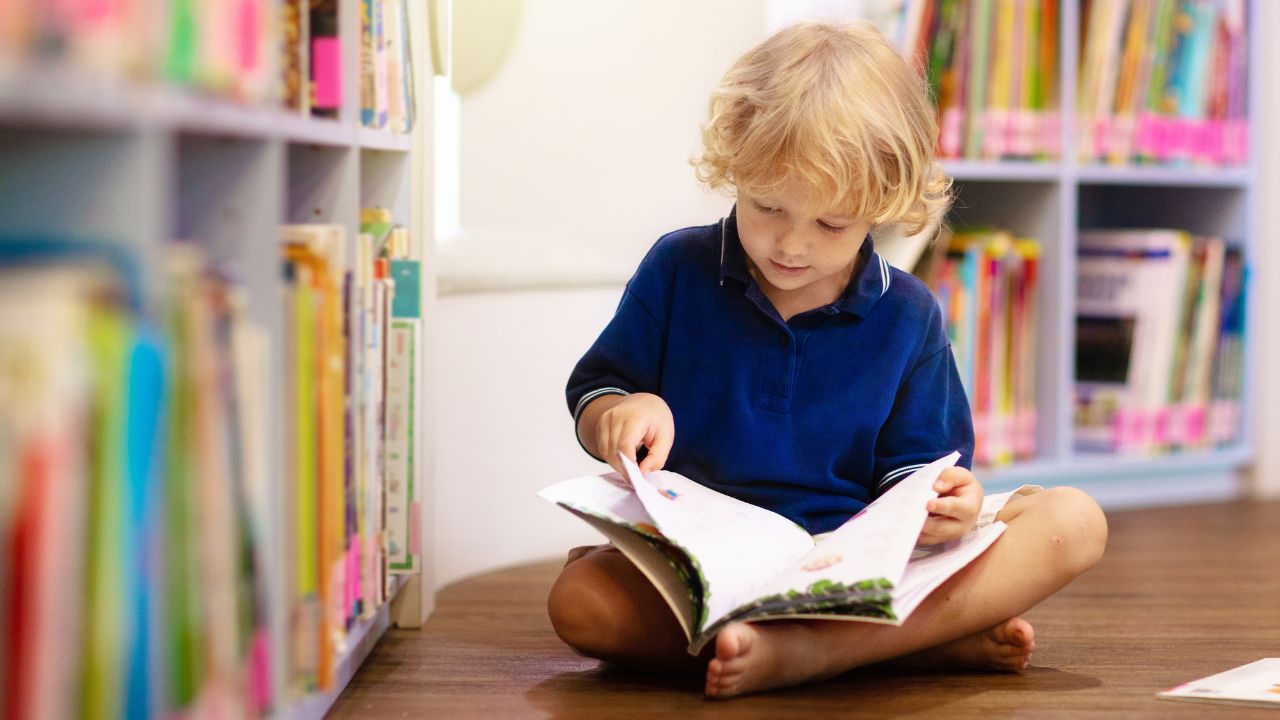 child reading in the library