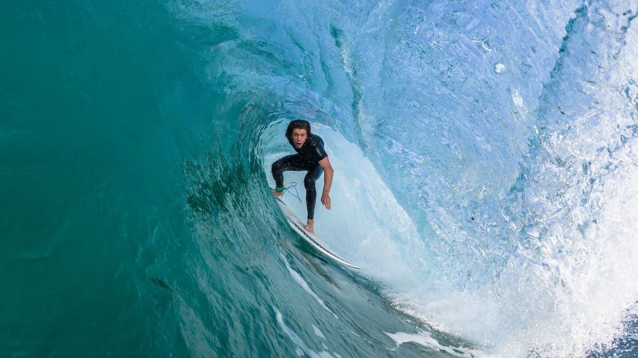 Yalla Dubai Life Yalla Dubai Life - Indoor Surf Park in Dubai with a surfer riding a wave.