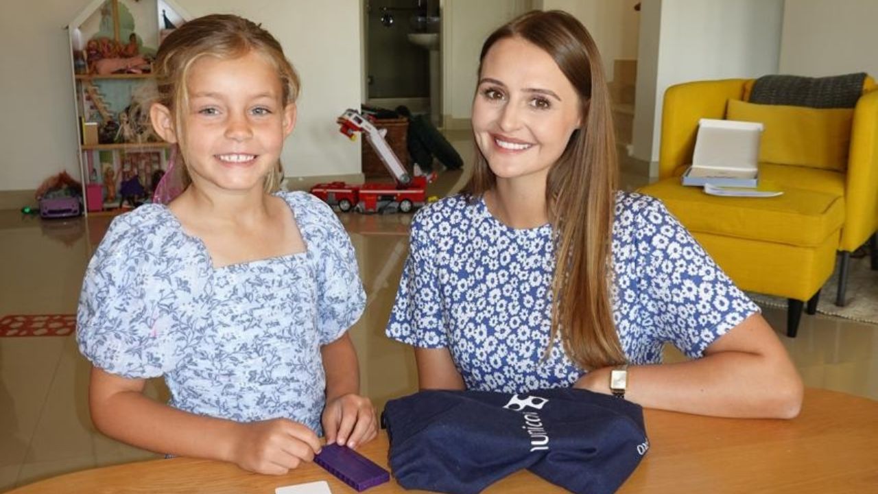 Tutor and student engaging in educational activities at home.