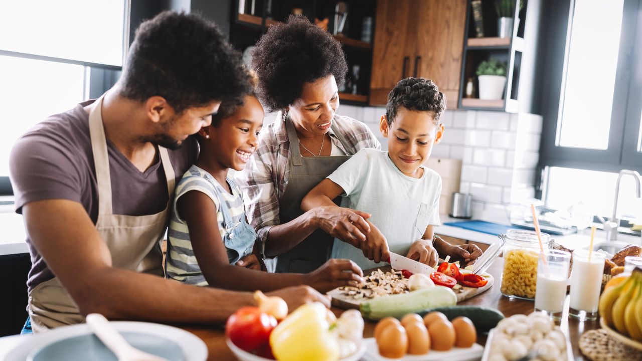 family making breakfast together