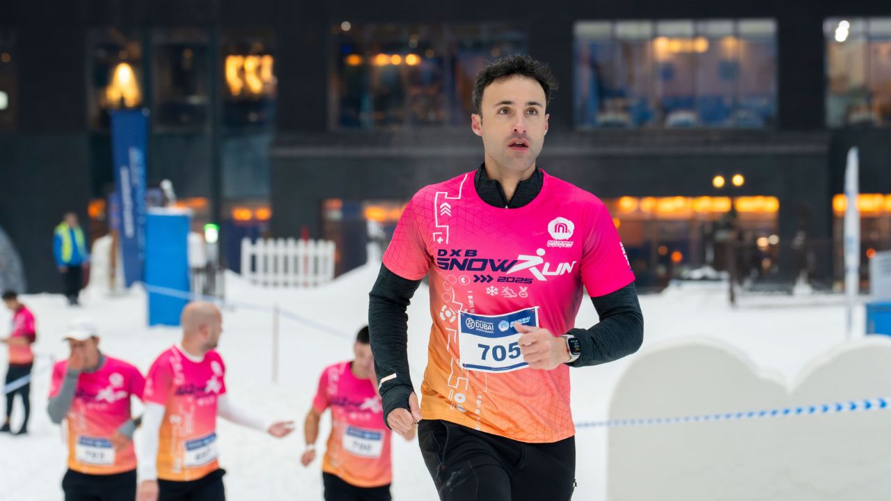 Runner participating in the DXB Snow Run event in Dubai.