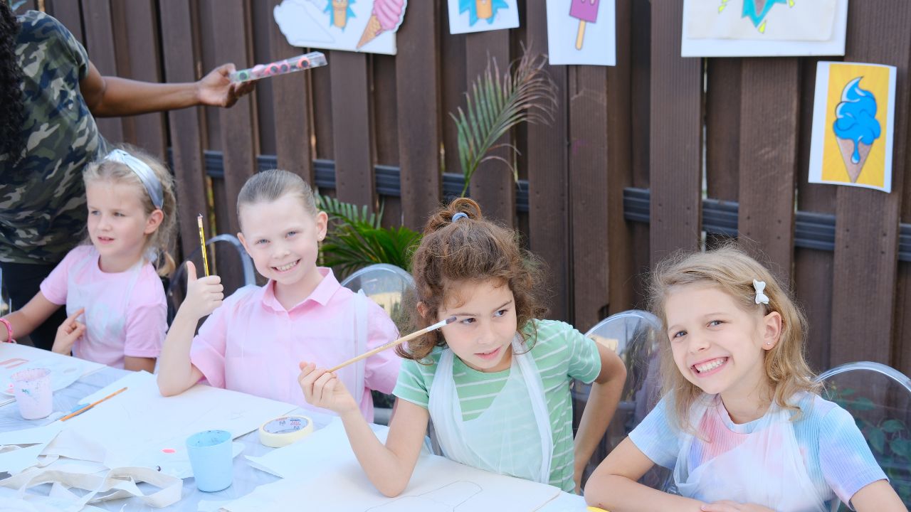 Children painting and drawing, fostering creativity and imagination in a home setting.