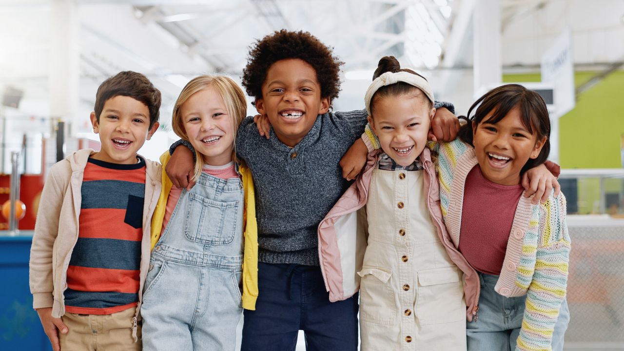 Children smiling at play in Dubai.