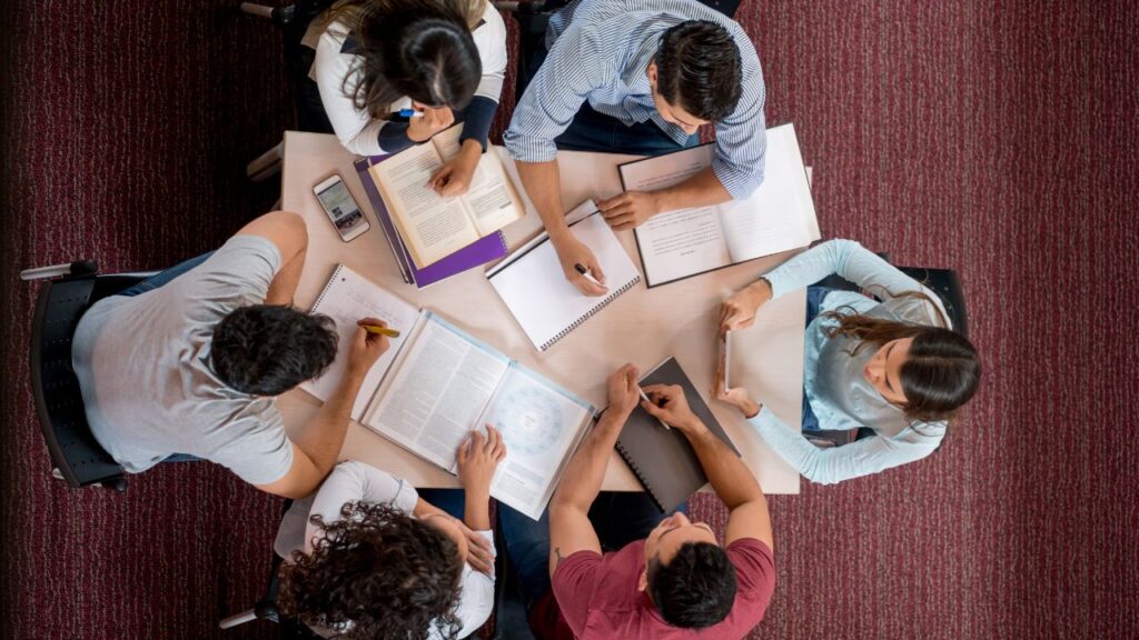 bunch of college students studying together