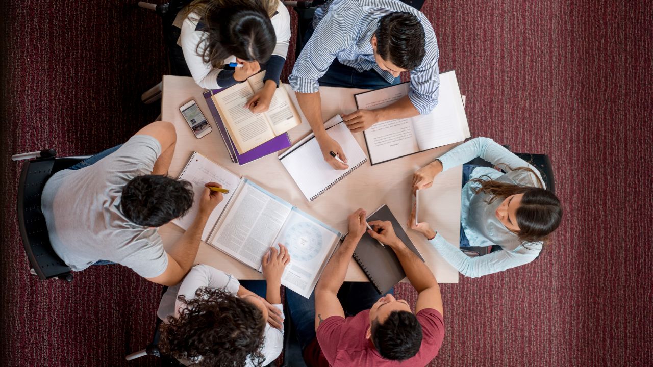 bunch of college students studying together