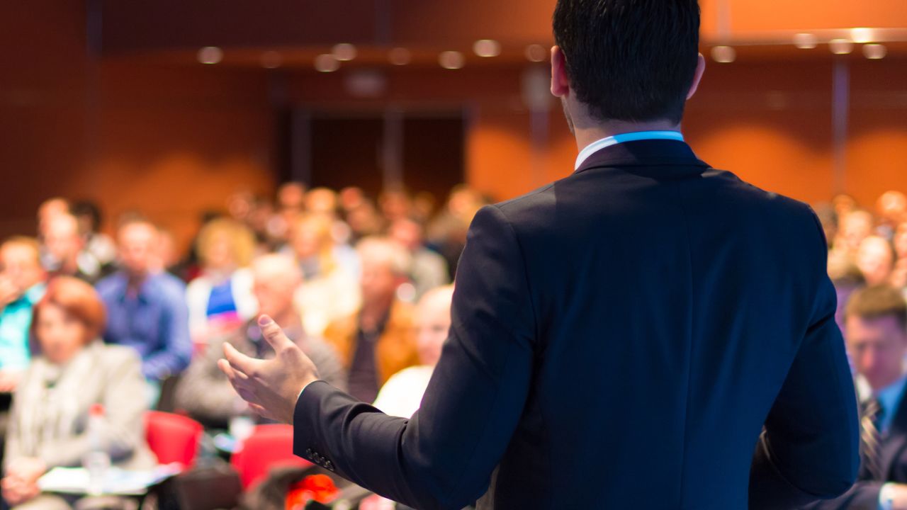 man talking to audience