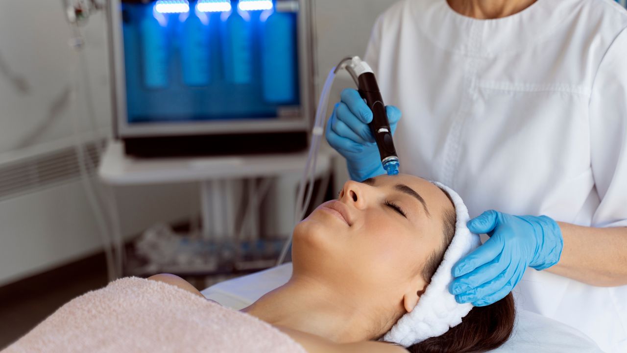 lady laying down getting skin treatment