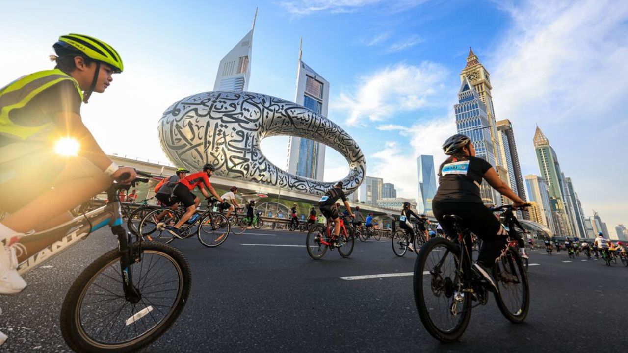 Riders during Dubai Ride with Museum of the Future view in Dubai