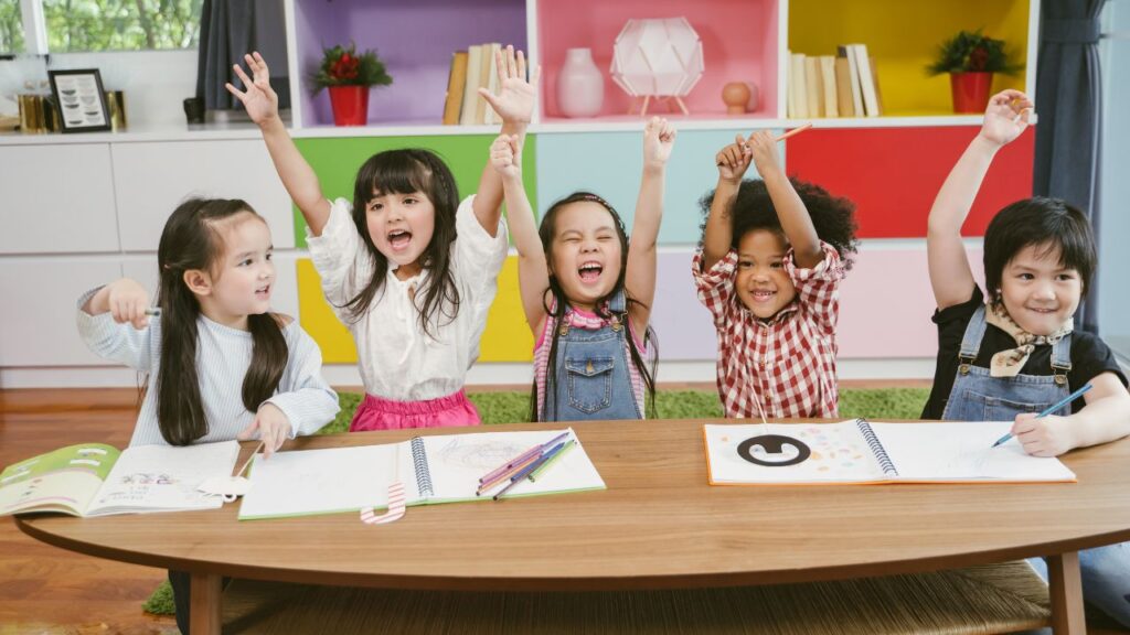 children raising their hand up