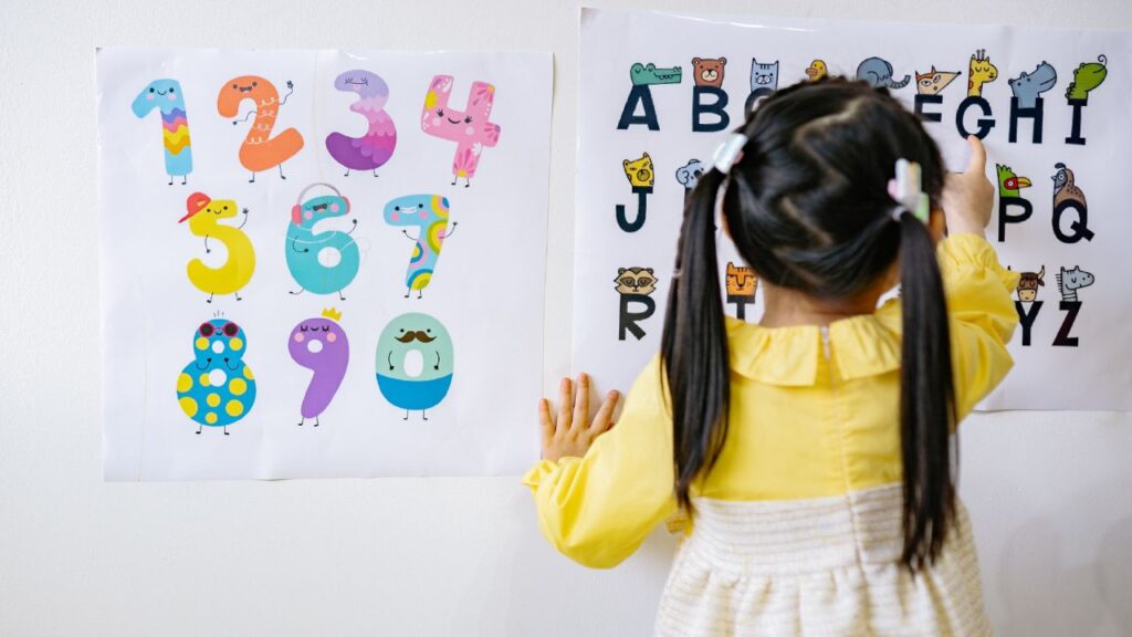 little girl checking out numbers