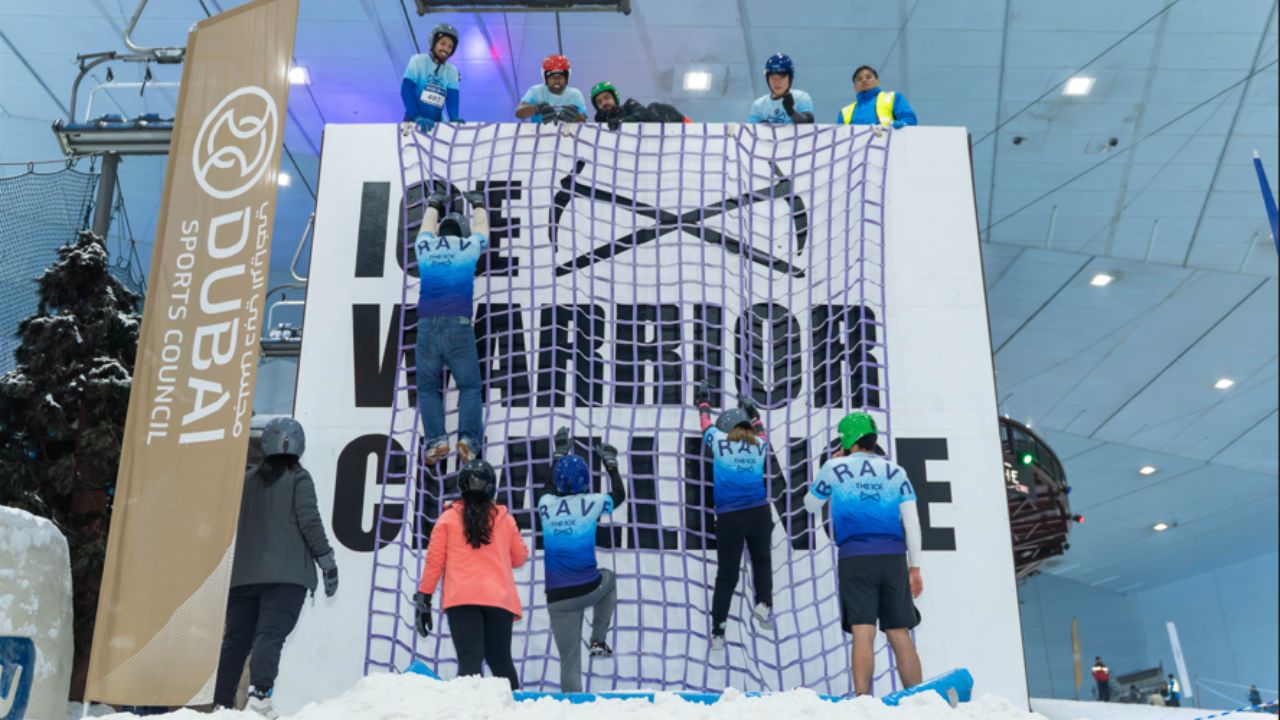 ski dubai people climbing up rope