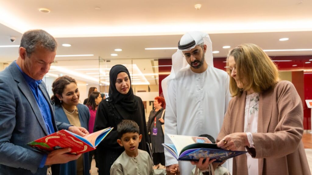 An Emirati family and few adults with books on their hands