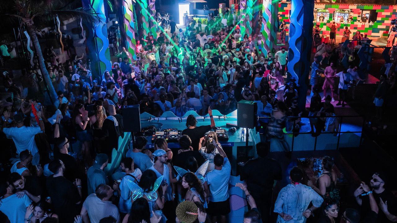 people dancing at a night club party