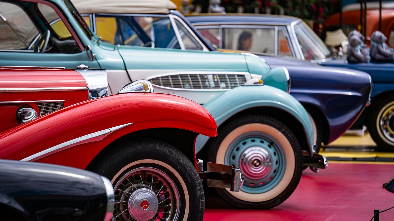 colorful vintage cars lined up