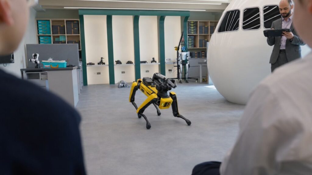 people looking at a robot dog