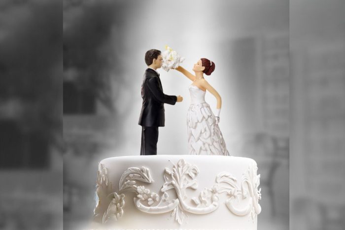 A cake topper for a wedding cake with the bride smearing icing on the groom for Paramount MT Wedding story brunch this Eid Al Adha in Dubai