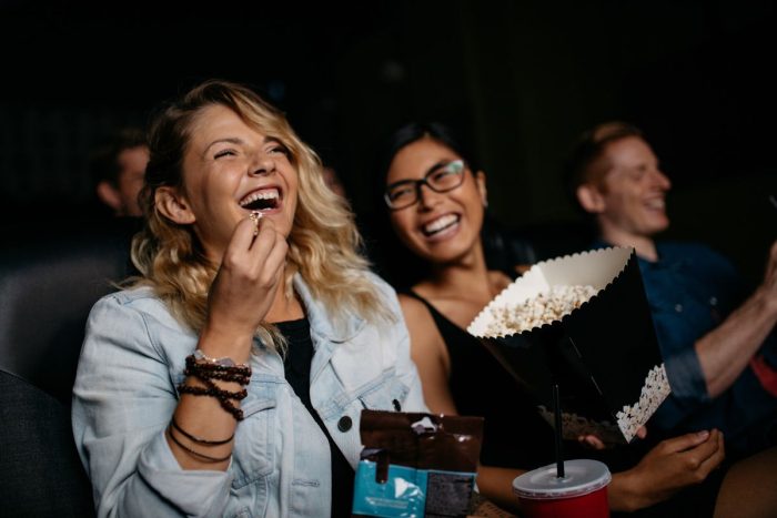 An audience laughing at a comedy show